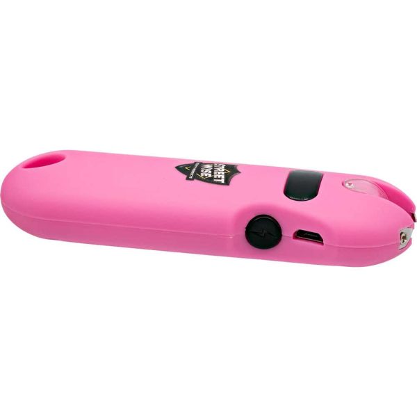 Pink self-defense stun gun with flashlight feature, portable and ideal for personal safety.
