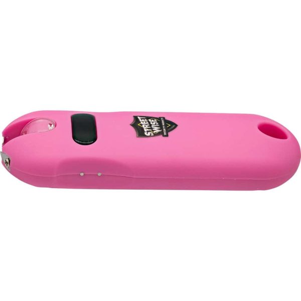 Pink stun gun with a black button and branding, designed for personal safety and self-defense.
