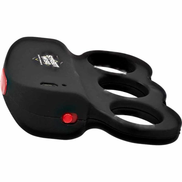 Compact black stun device with finger grip and red button for personal safety and self-defense use.
