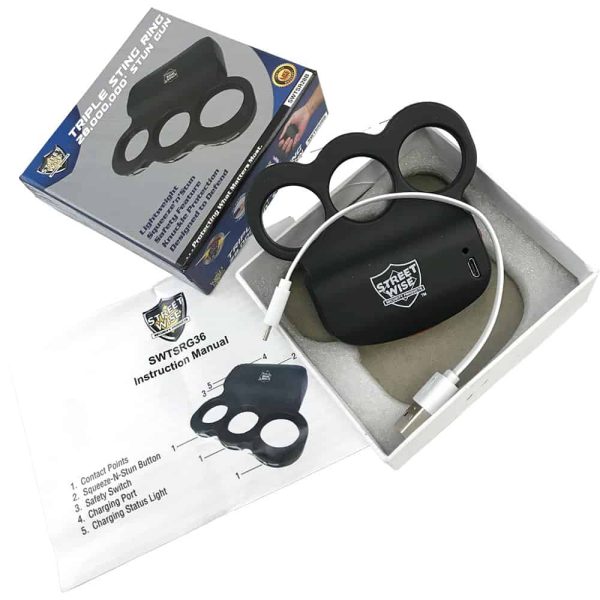 Triple Sting Ring stun gun with instructions, charger, and packaging, offering 28 million volts protection.