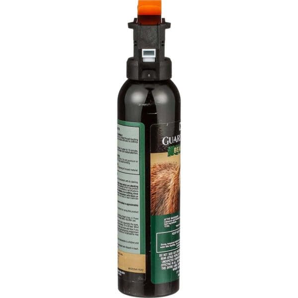 Bear spray canister with safety cap and label detailing use and caution information, essential for outdoor protection.
