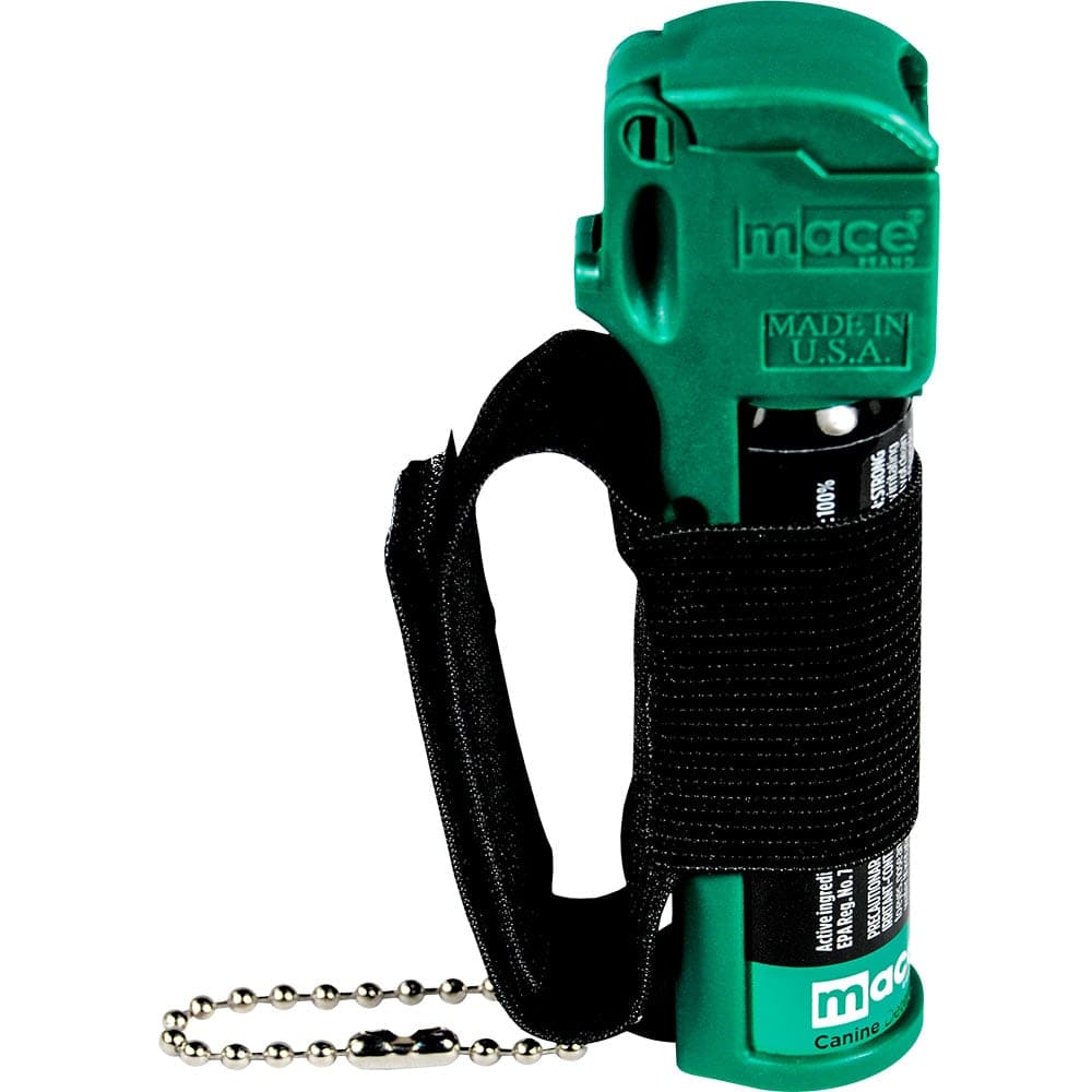 Green Mace dog repellent spray with wrist strap and safety chain for self-defense.