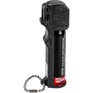 Black pepper spray with keychain attachment, labeled for safety. Ideal for personal security.