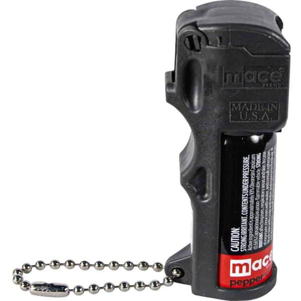 Compact Mace pepper spray with safety cap and keychain attachment, made in USA for personal self-defense.