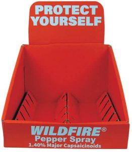 Empty Wildfire pepper spray display box with a Protect Yourself message in bold red.