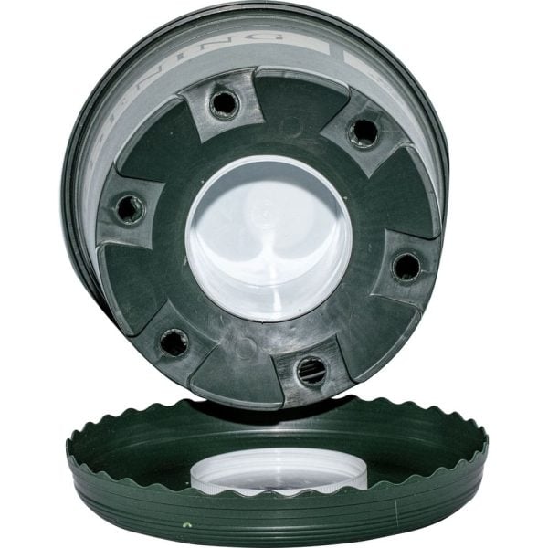 Green plant pot with drainage holes and saucer, ideal for indoor gardening.