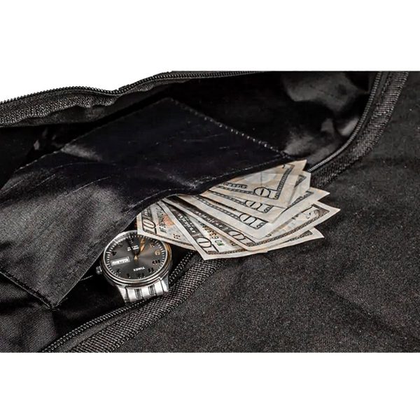 Watch and cash tucked in open black bag pocket, symbolizing wealth and security.