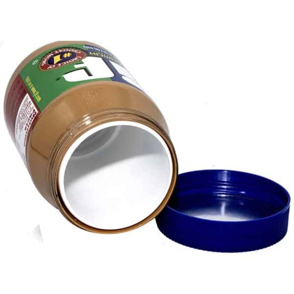 Open empty peanut butter jar with blue lid on white background.