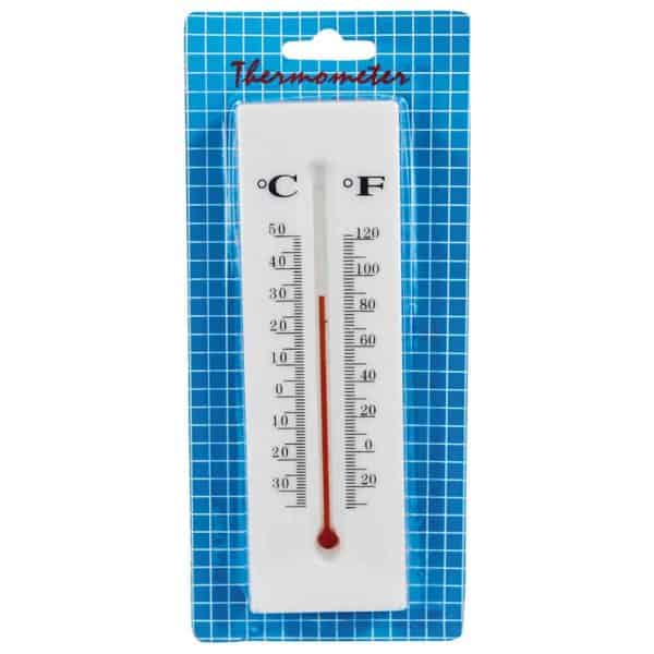Wall thermometer showing both Celsius and Fahrenheit scales in packaging against a blue grid background.