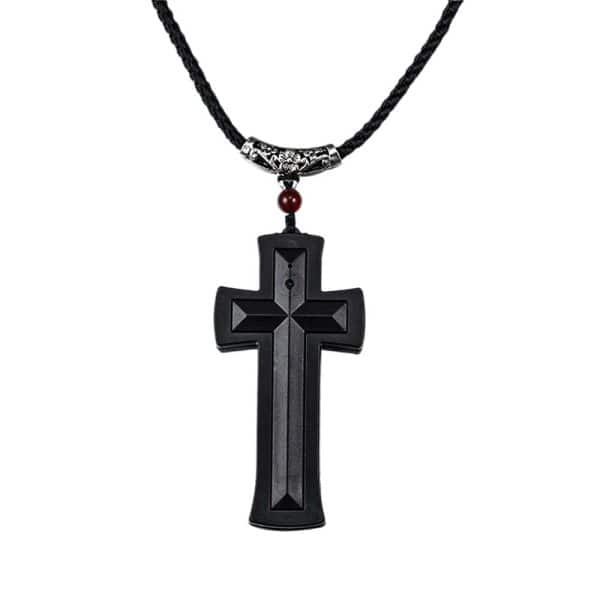 Black cross pendant with intricate design on a rope necklace.