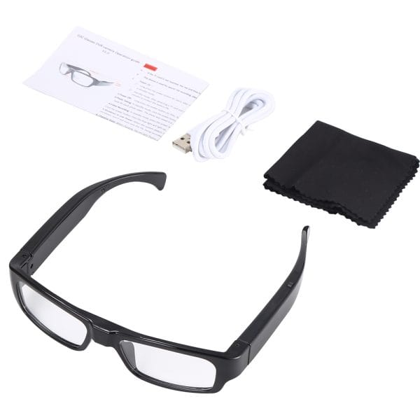 Smart glasses with USB cable, cleaning cloth, and instruction manual on a white background.
