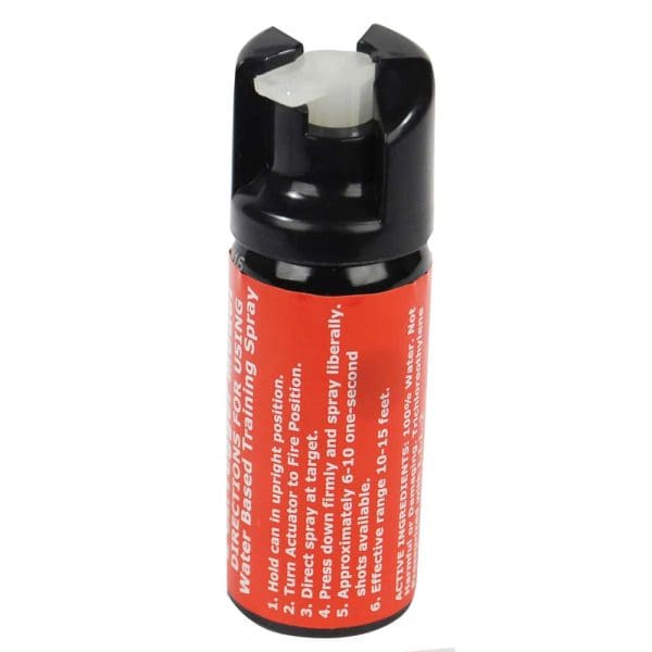 Red and black pepper spray can with instructions visible, for self-defense and safety training purposes.