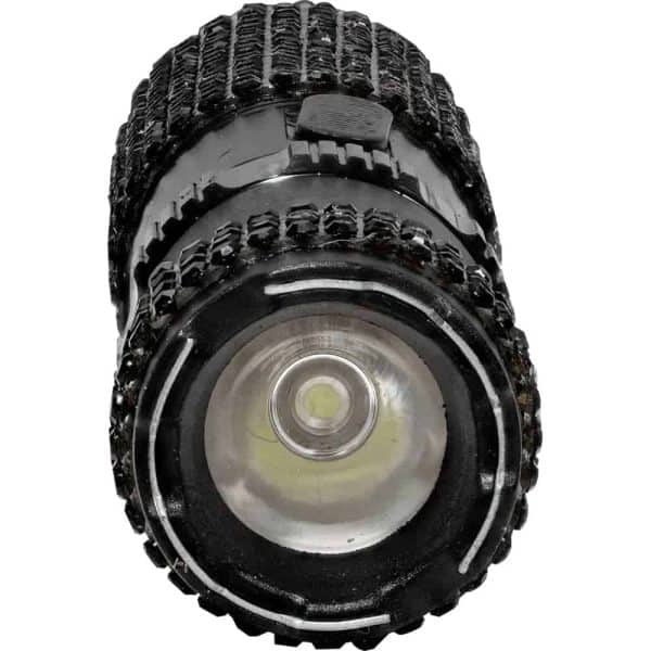 Close-up of a black textured flashlight barrel showing the lens and on/off switch.