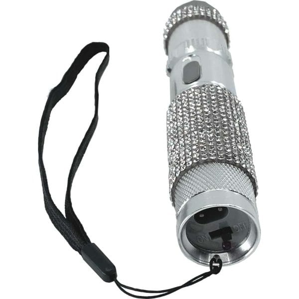 Silver rhinestone flashlight with wrist strap. Elegant design, portable light source for style and convenience.