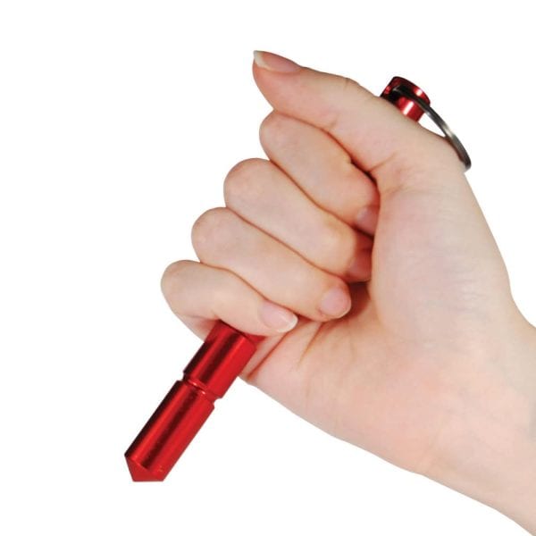 Hand holding red aluminum self-defense keychain tool.
