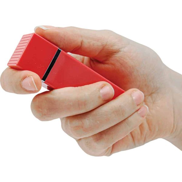 Hand holding a red handheld voice recorder or microphone device, isolated on white background.