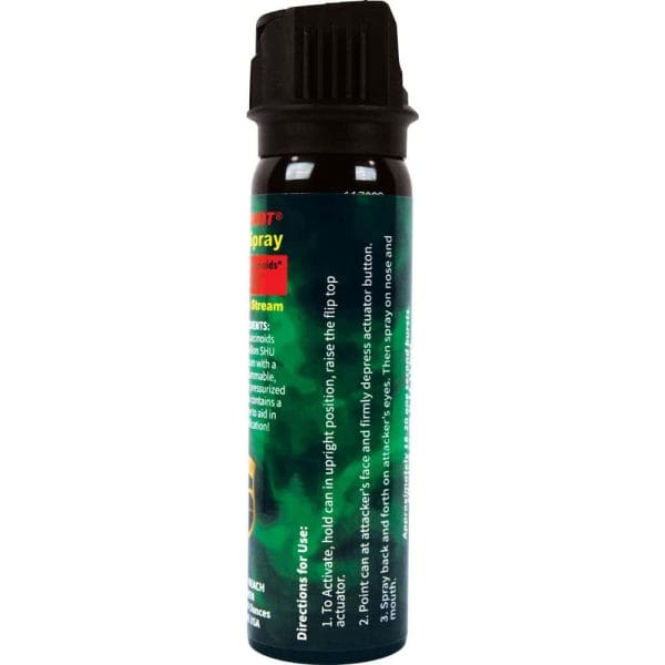 Pepper spray can with detailed usage instructions and black safety cap.