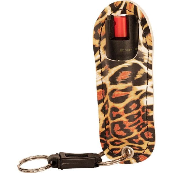 Leopard print pepper spray keychain with protective case and metal ring for personal safety.