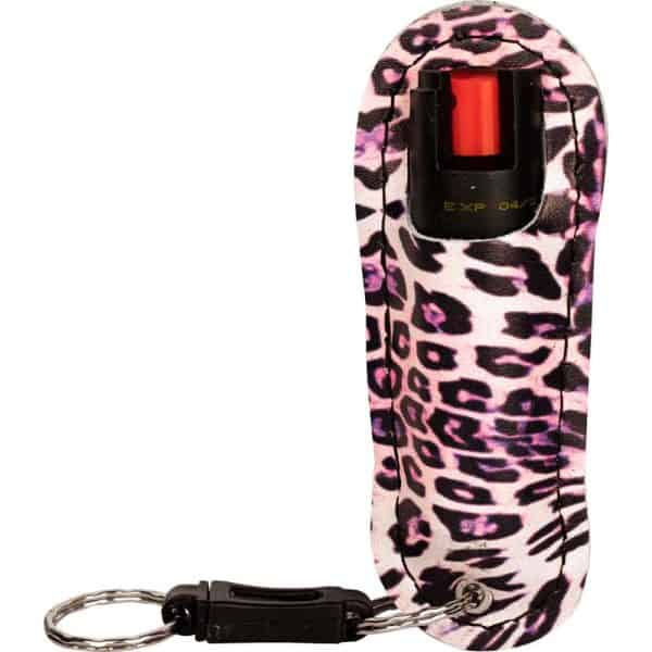 Leopard print pepper spray keychain with safety clip, designed for self-defense and easy portability.