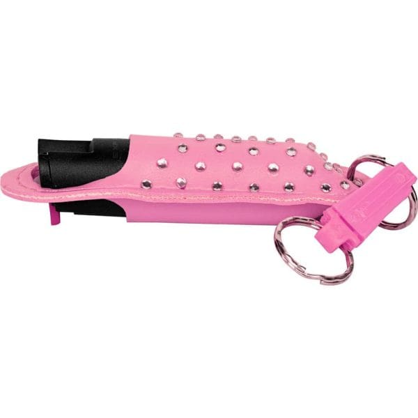 Pink rhinestone-studded self-defense spray with keychain attachment, stylish and practical for personal security.