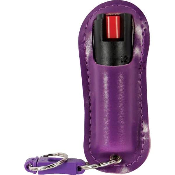 Purple pepper spray in a protective case with keychain attachment for personal safety and easy access.