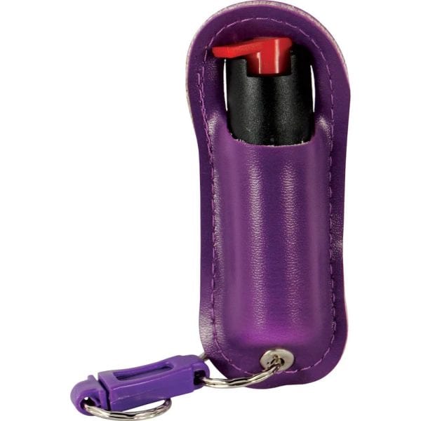 Purple pepper spray keychain with leather holder, featuring a red trigger and attached keyring for personal safety.