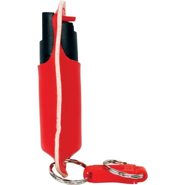 Red pepper spray canister with keychain for personal safety and self-defense.