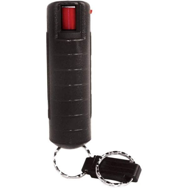 Keychain pepper spray in black casing with safety lock, ideal for personal self-defense.