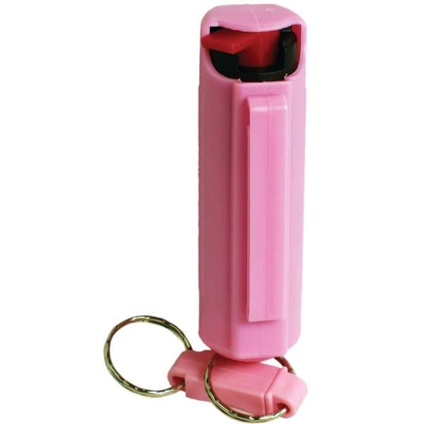 Pink keychain pepper spray for personal safety and self-defense. Compact design with a secure grip for easy access.