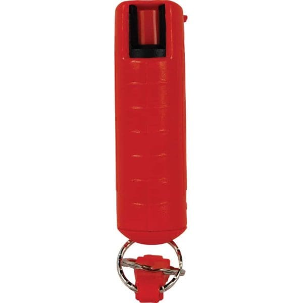Red pepper spray canister with keychain attachment for personal safety and self-defense.