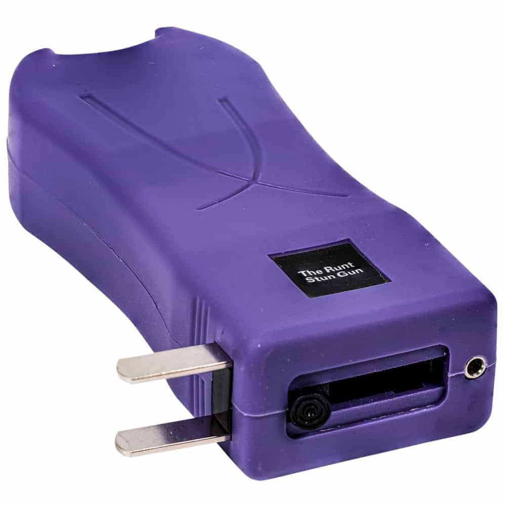 Purple stun gun for personal safety, compact design with charging prongs visible.