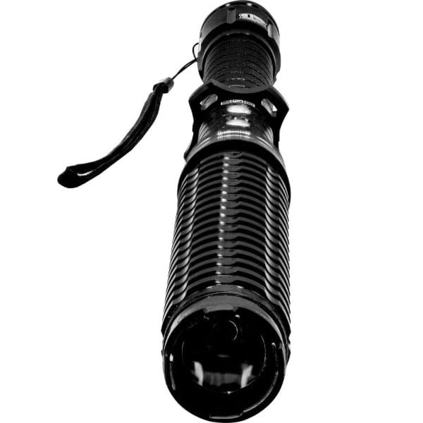 Black tactical flashlight with textured grip and wrist strap, viewed from below.