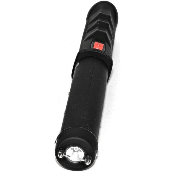 Portable black flashlight with red switch, close-up shot on a white background.