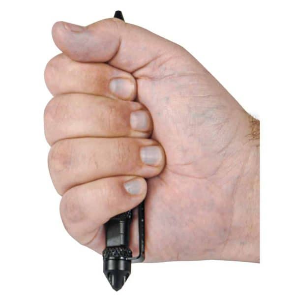 Hand gripping black tactical pen for self-defense and emergency glass breaking.
