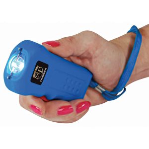 Hand holding a blue stun gun with a wrist strap, activating the electric charge.