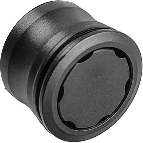 Black cylindrical metal object, possibly a magnetic mount or accessory, with a smooth finish.