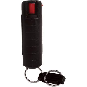Black pepper spray canister with keychain for self-defense and personal safety.